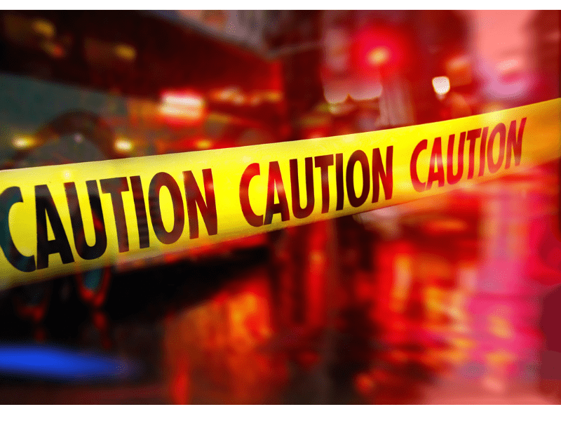 Caution Tape and Police Vehicles