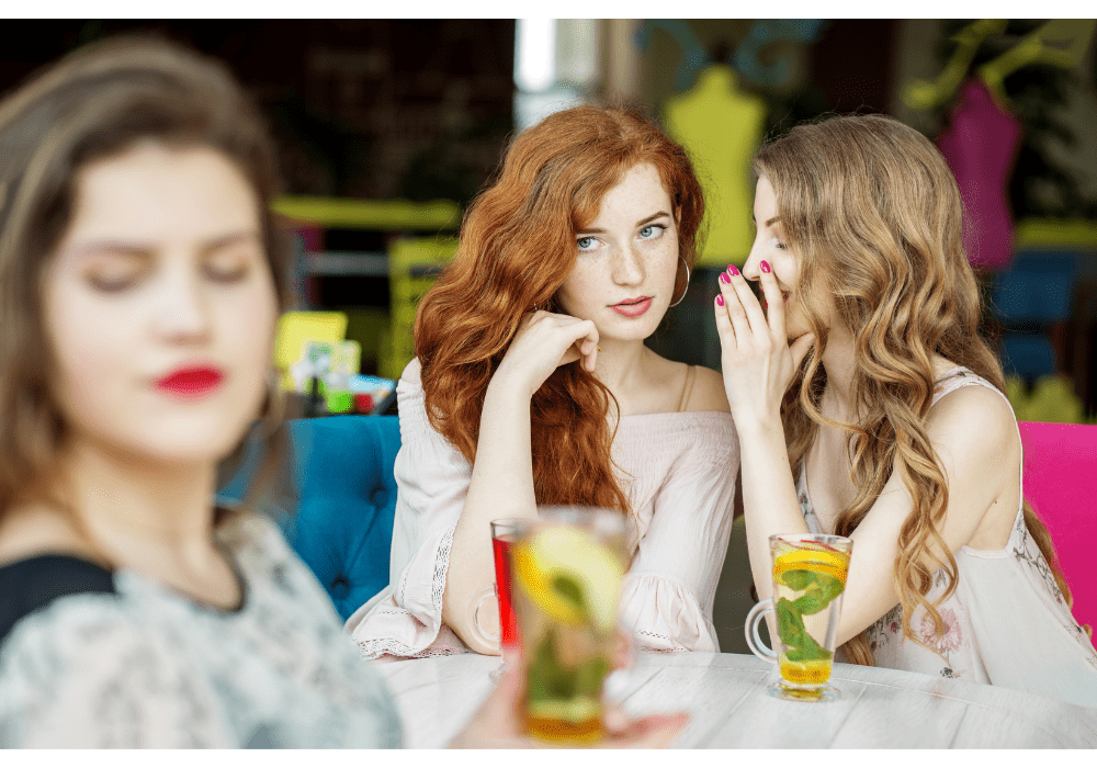 Two Women Talking About Another Woman