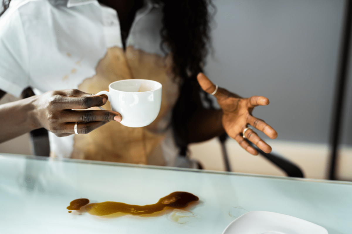 Woman Spilling Hot Coffee