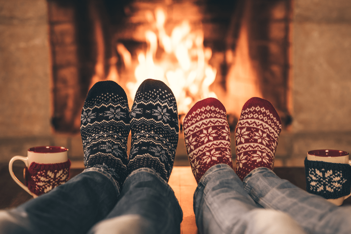 Child and Parent Sitting by the Fire.